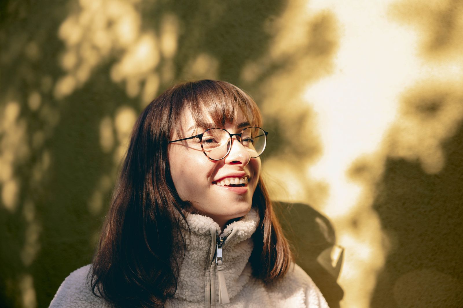 A woman wearing her glasses — her prescription history safe with RefraCard